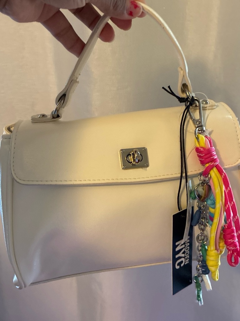 Chic Ivory Top-Handle Crossbody Bag with Colorful Charm